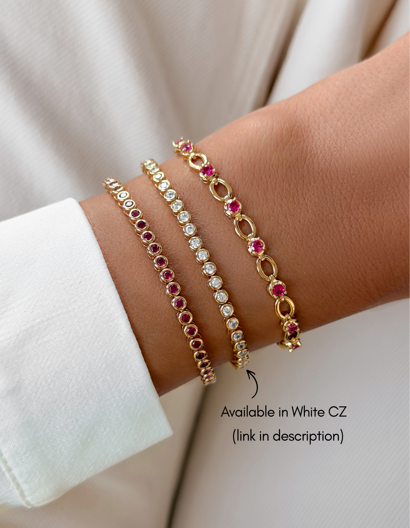 Gold Sami Jewels Ruby Bezel Tennis Bracelet with diamonds worn on a wrist, showcasing elegant jewelry design.