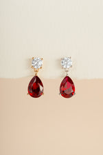 Sami Jewels Camille Ruby Pear Drop Earrings with gold and silver finish, featuring elegant ruby gemstone drops.