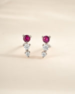 Close-up of Sami Jewels Ruby & Diamond Ear Climber earrings in sterling silver, showcasing vibrant rubies and sparkling diamonds.