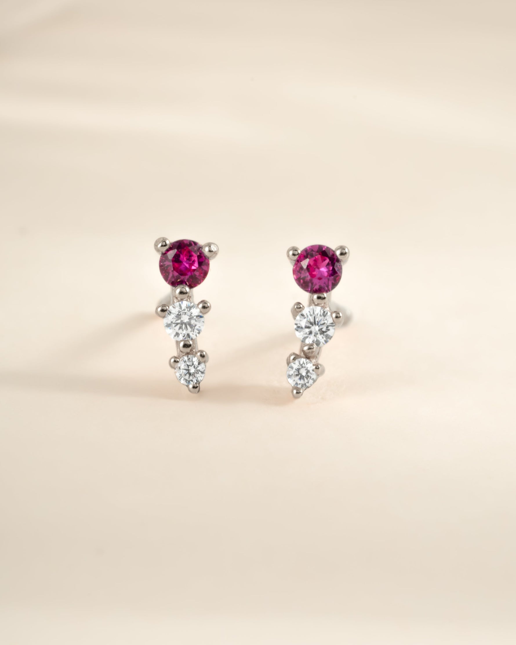 Close-up of Sami Jewels Ruby & Diamond Ear Climber earrings in sterling silver, showcasing vibrant rubies and sparkling diamonds.