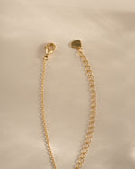 Gold Ruby Flower Necklace featuring a vibrant ruby flower charm and lobster clasp closure by Sami Jewels.