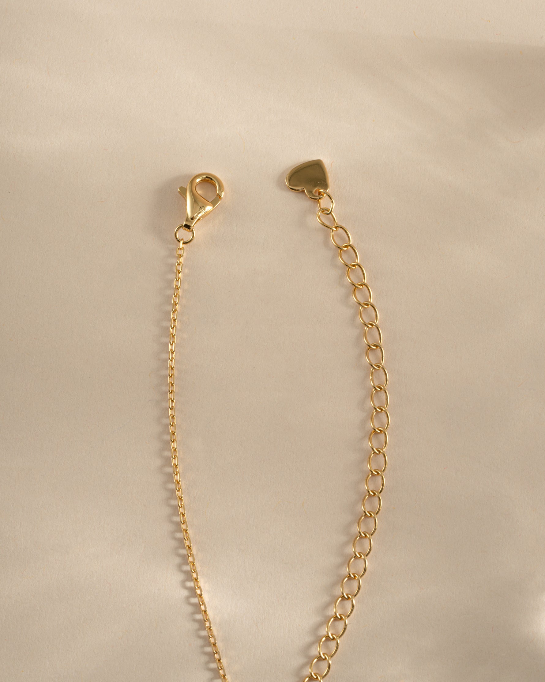 Gold Ruby Flower Necklace featuring a vibrant ruby flower charm and lobster clasp closure by Sami Jewels.