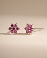 Sterling silver ruby flower stud earrings from Samijewels-527 featuring vibrant red gemstone floral design.