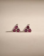 Sterling silver Tiny Ruby 3 Stone Stud Earrings by Sami Jewels with three vibrant rubies in a classic stud design.