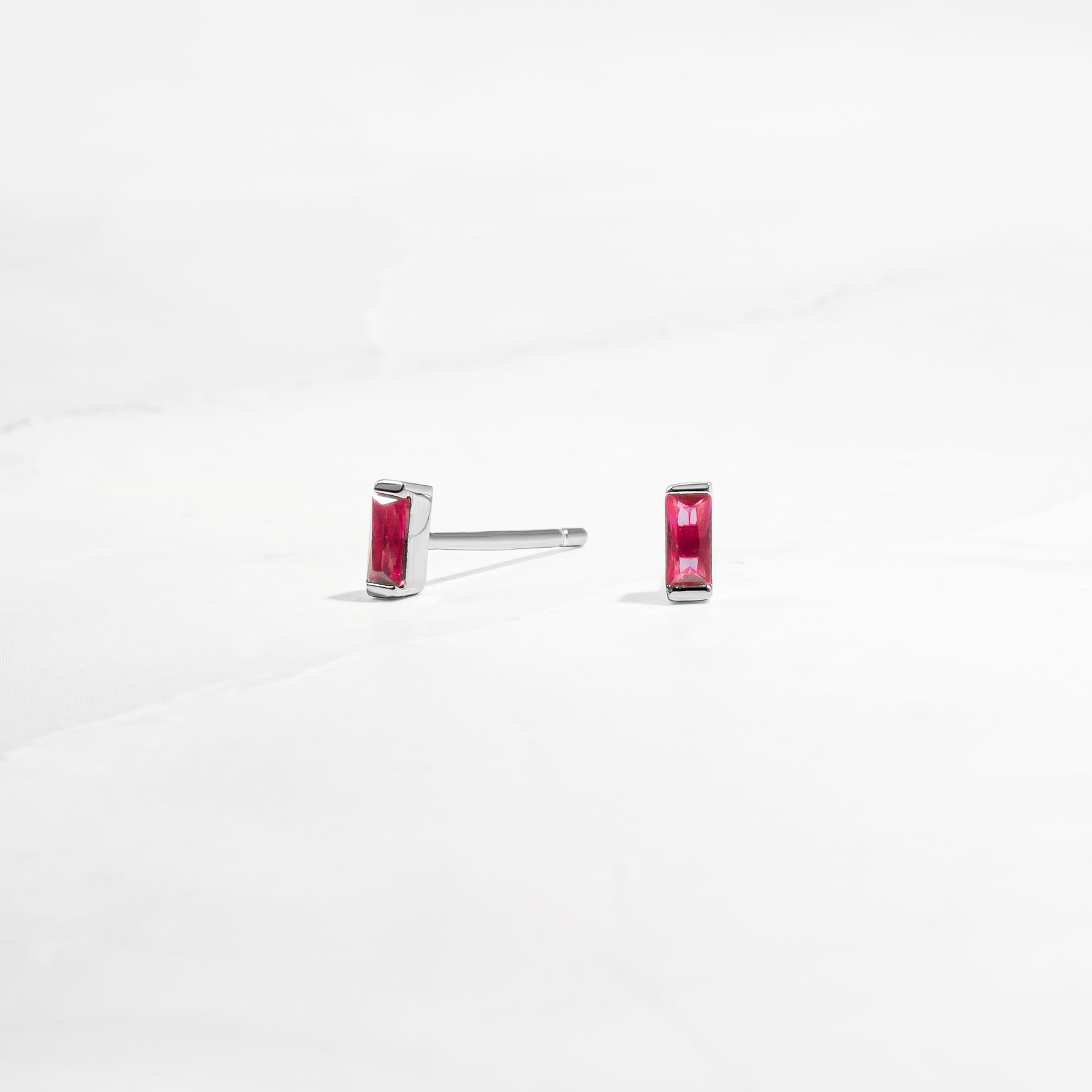 closeup image of ruby birthstone tiny studs earrings 