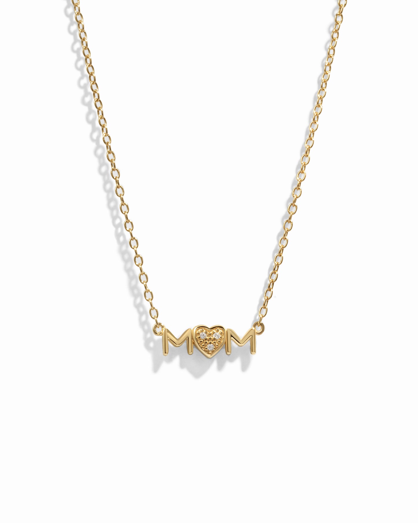 Closeup image of gold heart necklace for her
