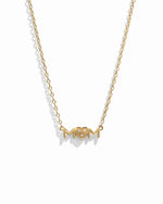 Closeup image of gold heart necklace for her