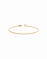 14K solid gold bar station chain bracelet on white background