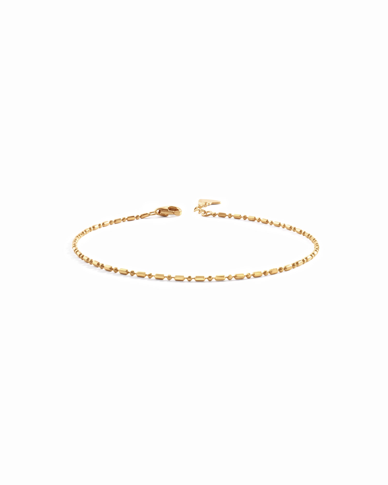 14K solid gold bar station chain bracelet on white background