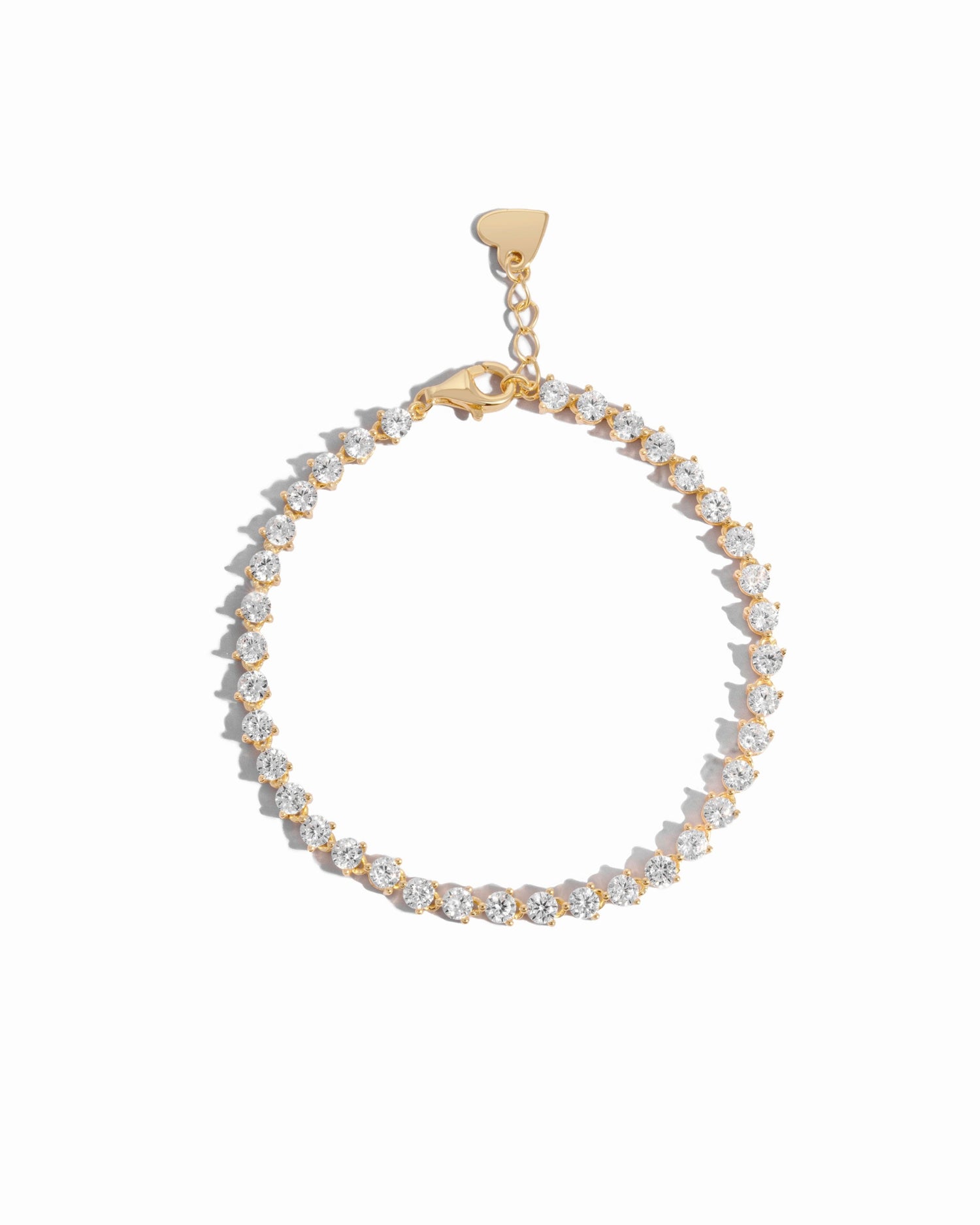 dainty gold tennis bracelet featuring cubic zirconia stones