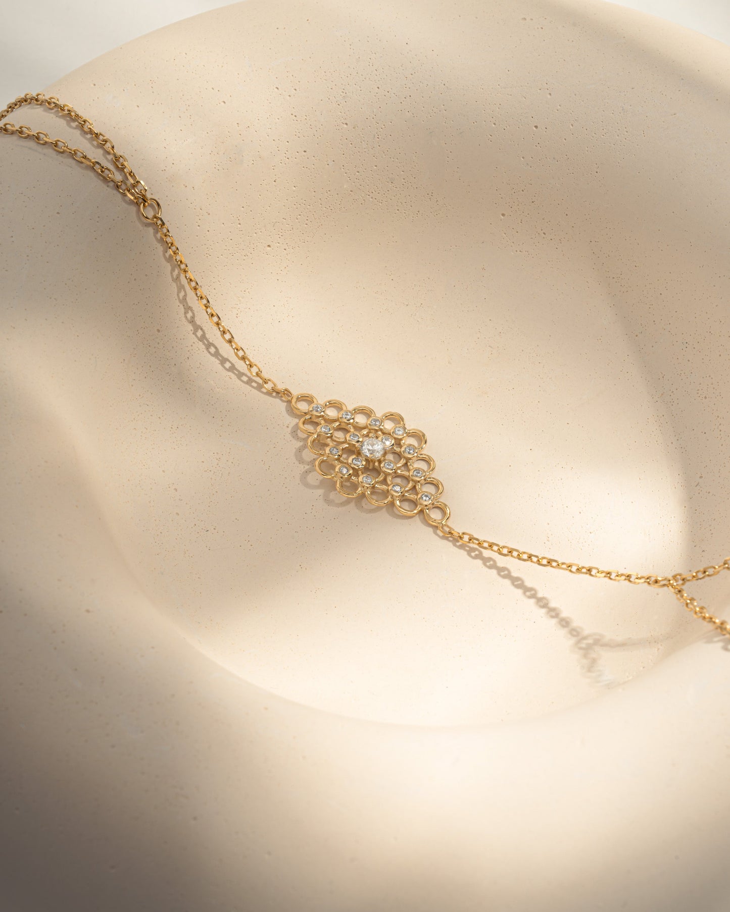 closeup image of gold slave bracelet hand chain