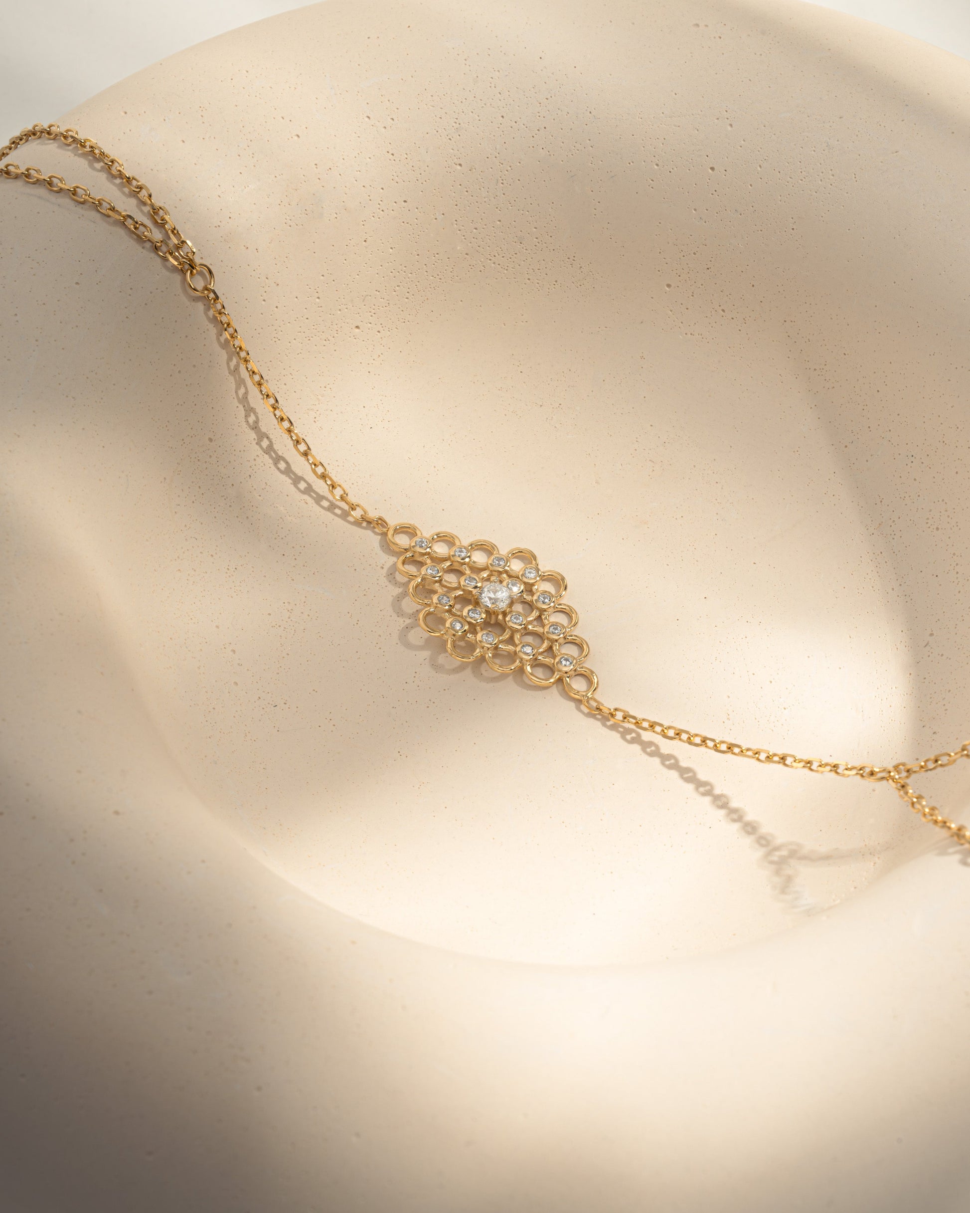 closeup image of gold slave bracelet hand chain