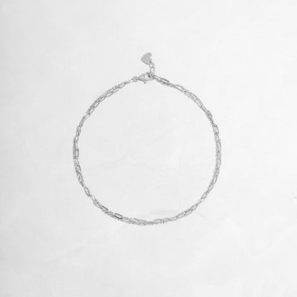 Closeup image of silver chain anklet set