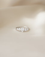 Sterling silver diamond ring on silk background 