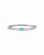 Sterling silver aquamarine jewelry featuring a silver bangle bracelet and a baguette stone