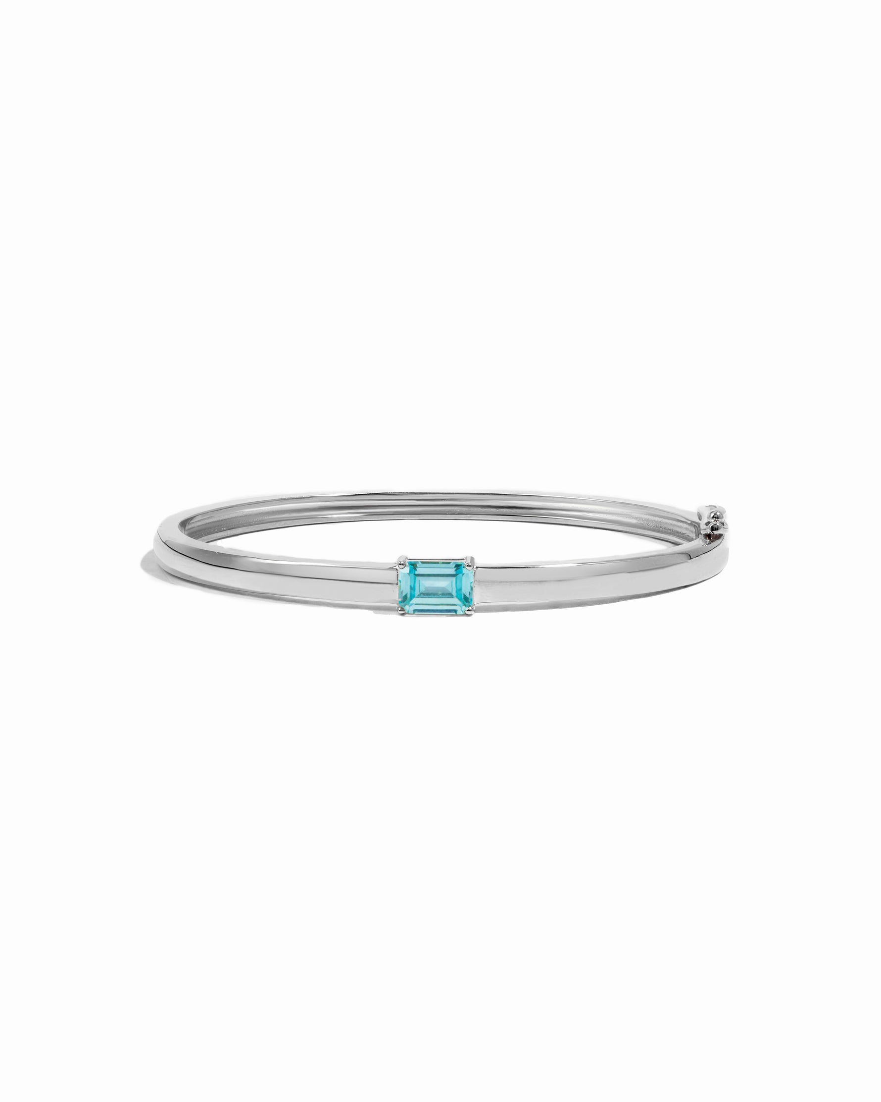 Sterling silver aquamarine jewelry featuring a silver bangle bracelet and a baguette stone