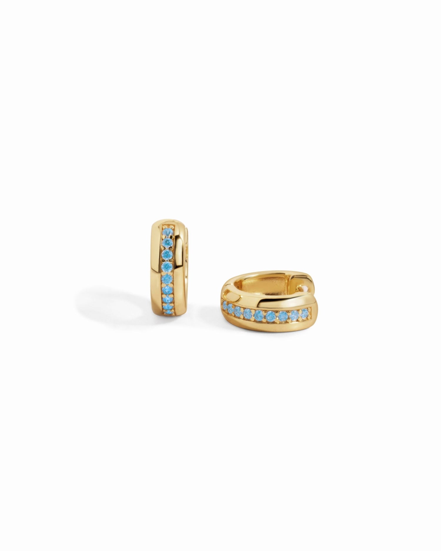 Tiny aquamarine hoop earrings in gold