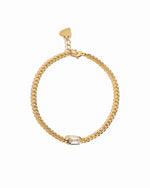 Gold chain bracelet with a bezeled baguette stone