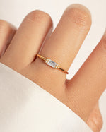 model wearing dainty gold ring