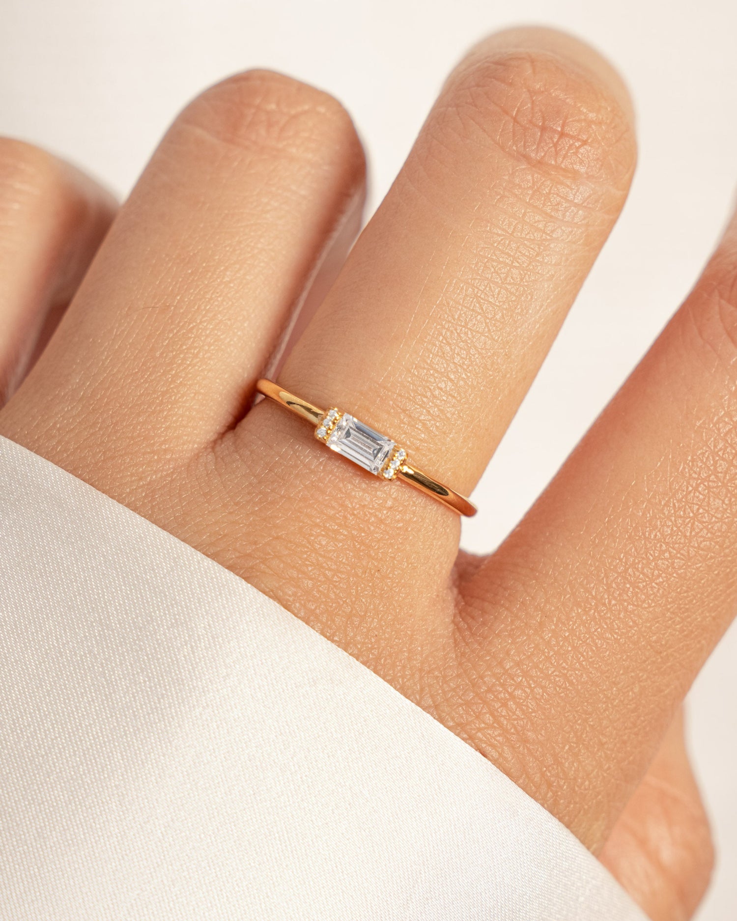 model wearing dainty gold ring
