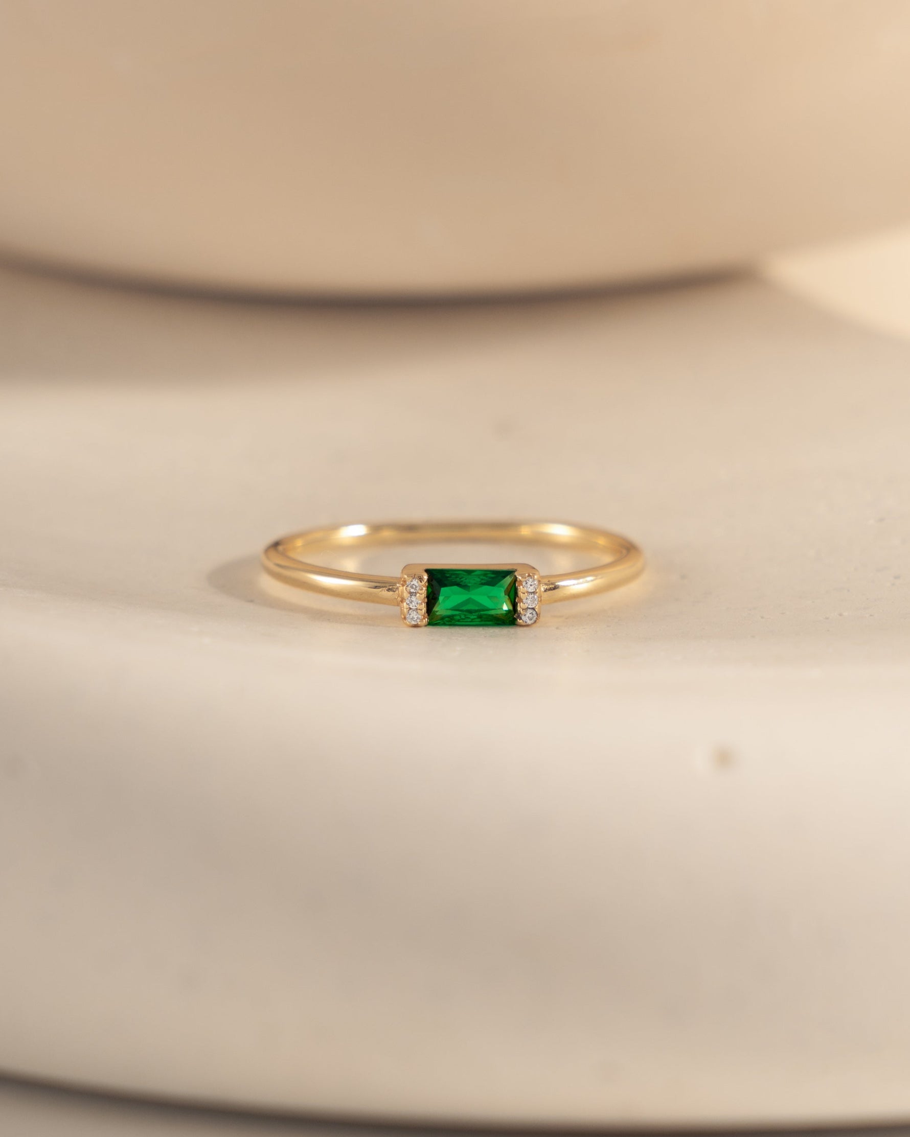 closeup image of emerald green cz ring