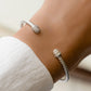 model wearing silver bangle cuff bracelet 