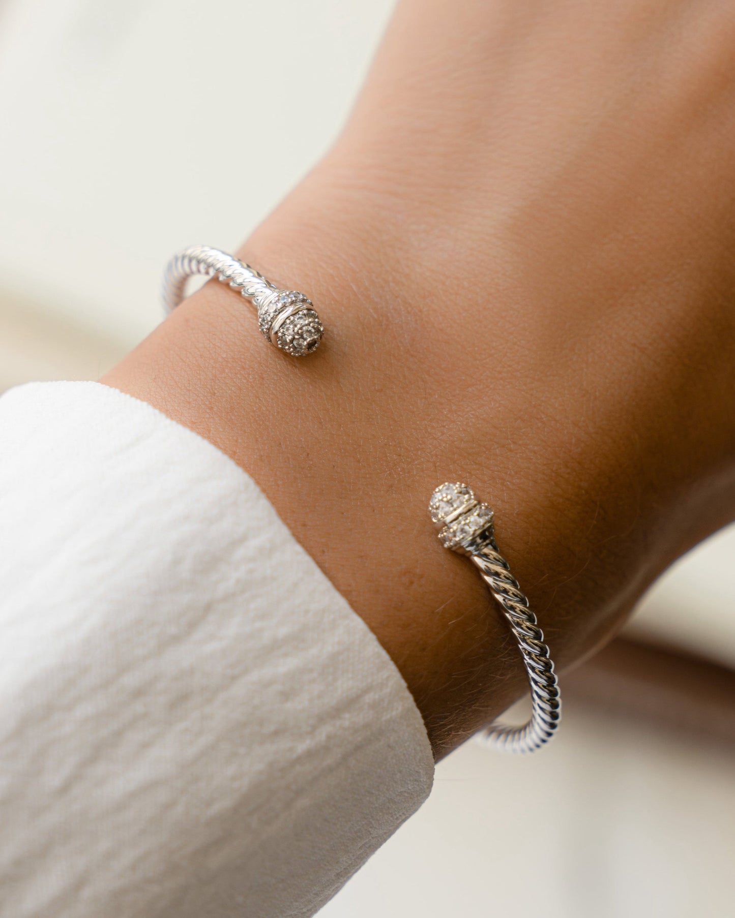 model wearing silver bangle cuff bracelet 