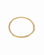 Overhead view of diamond bangle bracelet in 14k gold plating  