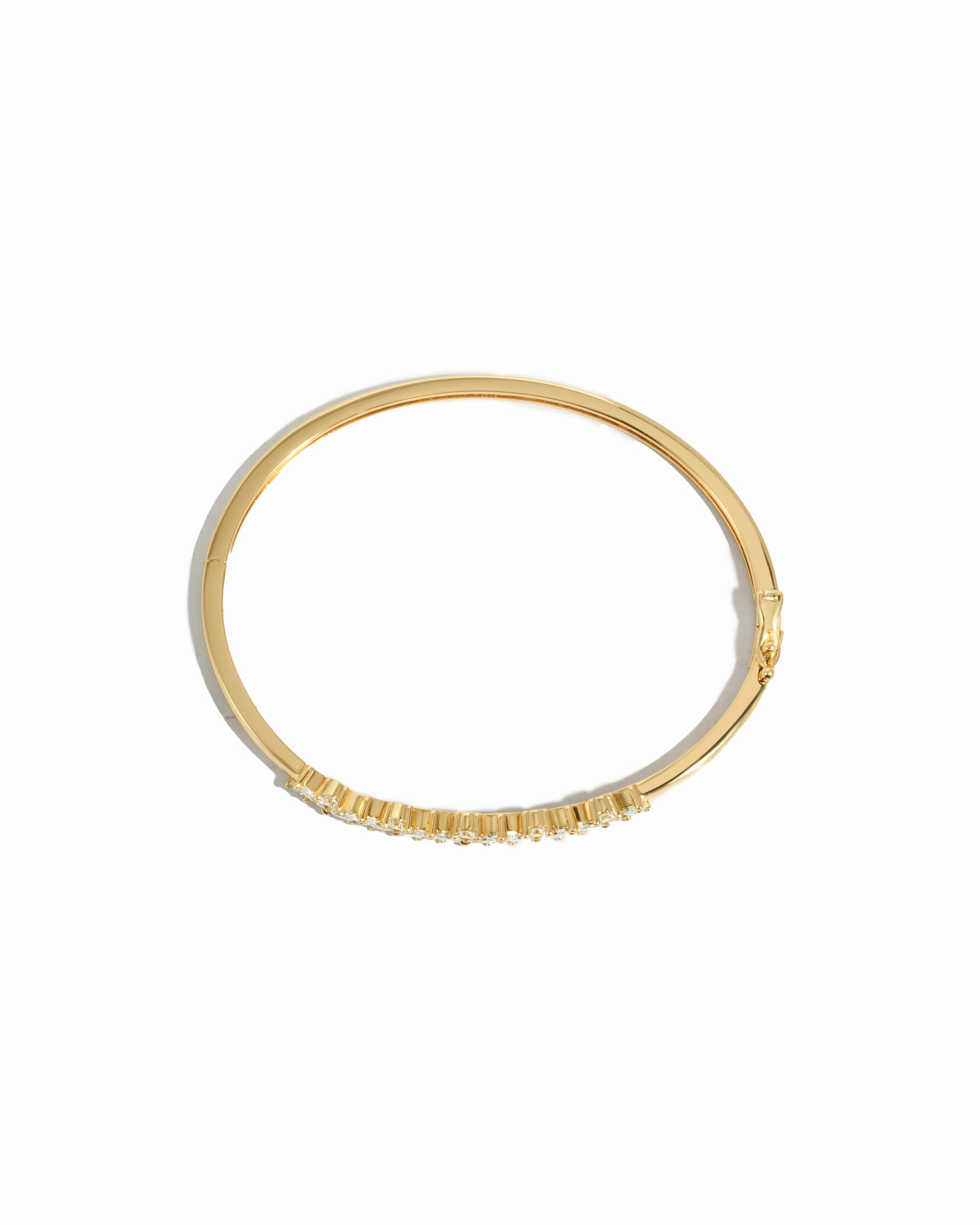 Overhead view of diamond bangle bracelet in 14k gold plating  