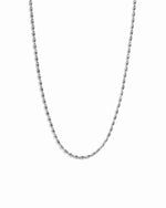Silver chain beaded necklace on a white background
