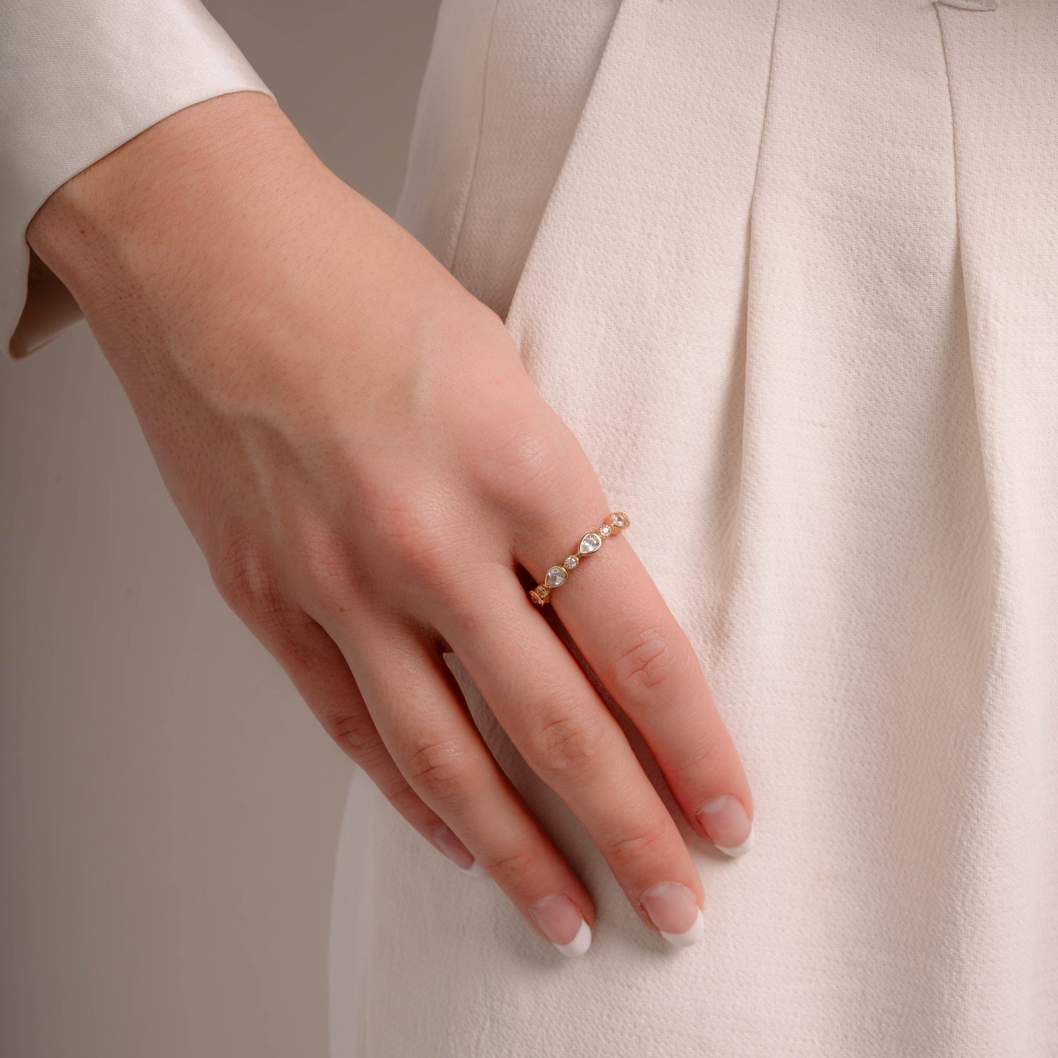 Model wearing gold bezel ring 
