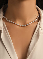 Model wearing silver bridal necklace featuring a minimalist necklace design