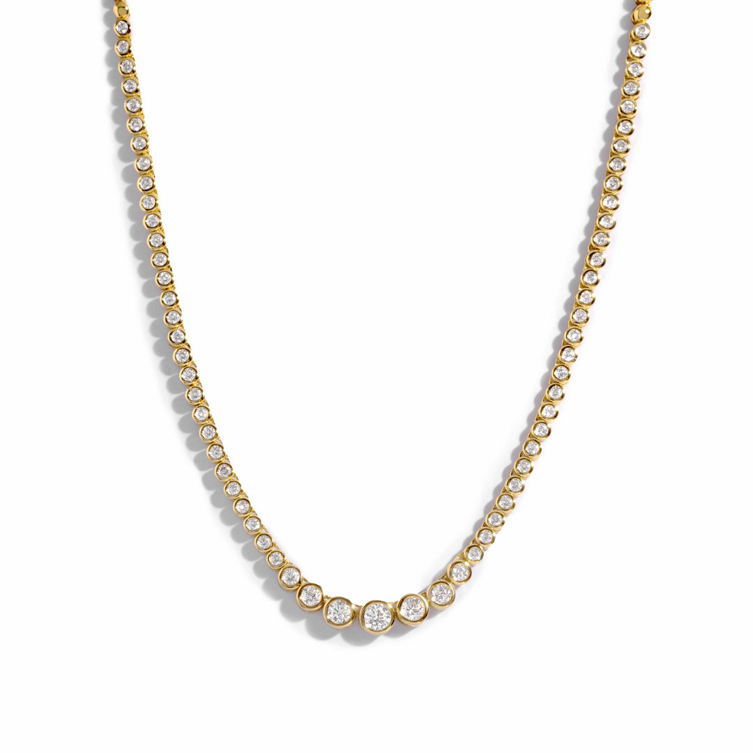 gold necklace set in a diamond tennis chain