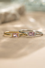 Gold birthstone ring and matching sterling silver ring with the october birthstone