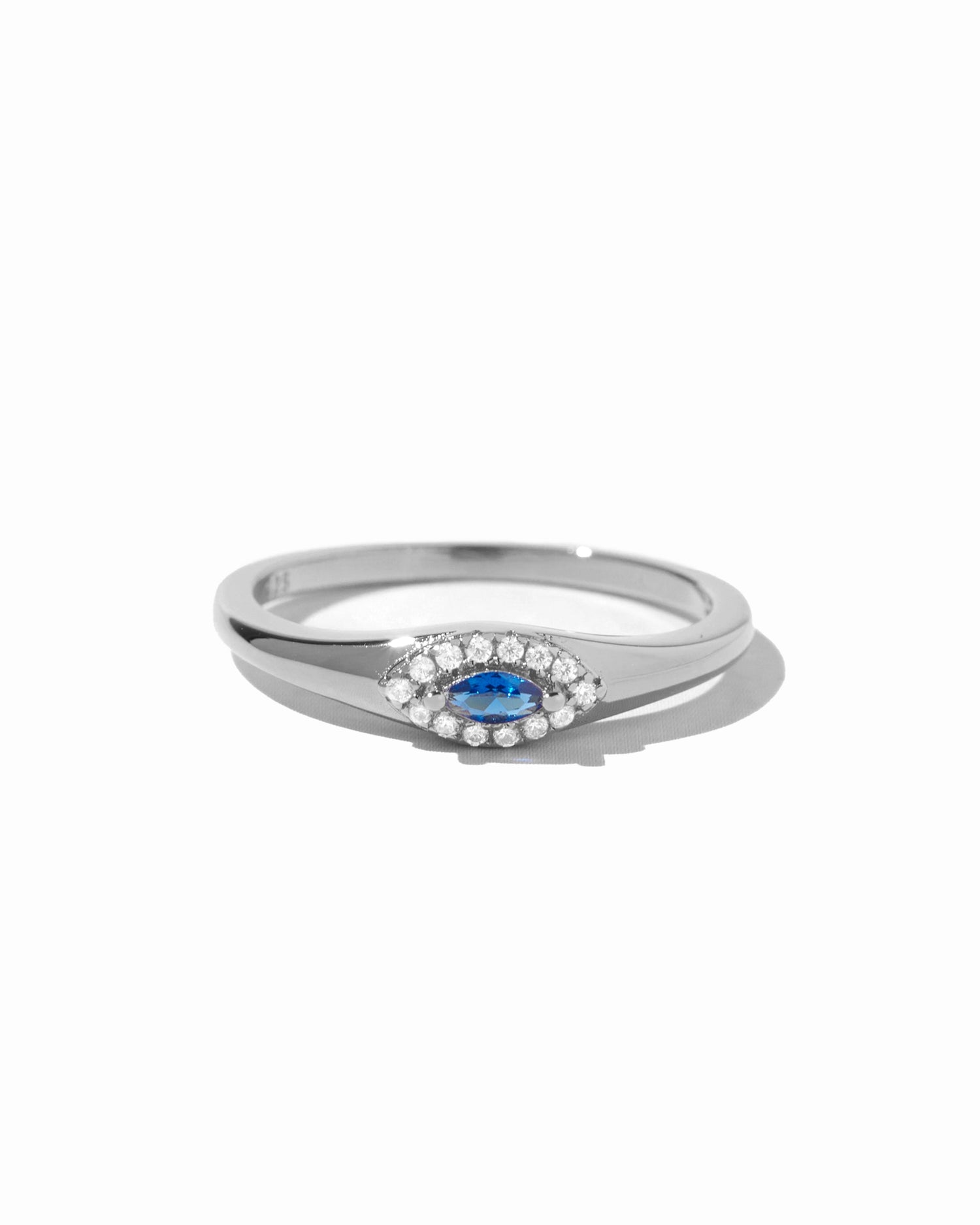 Silver ring with a blue gemstone and evil eye ring design