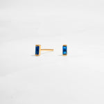 closeup image of dainty blue earrings