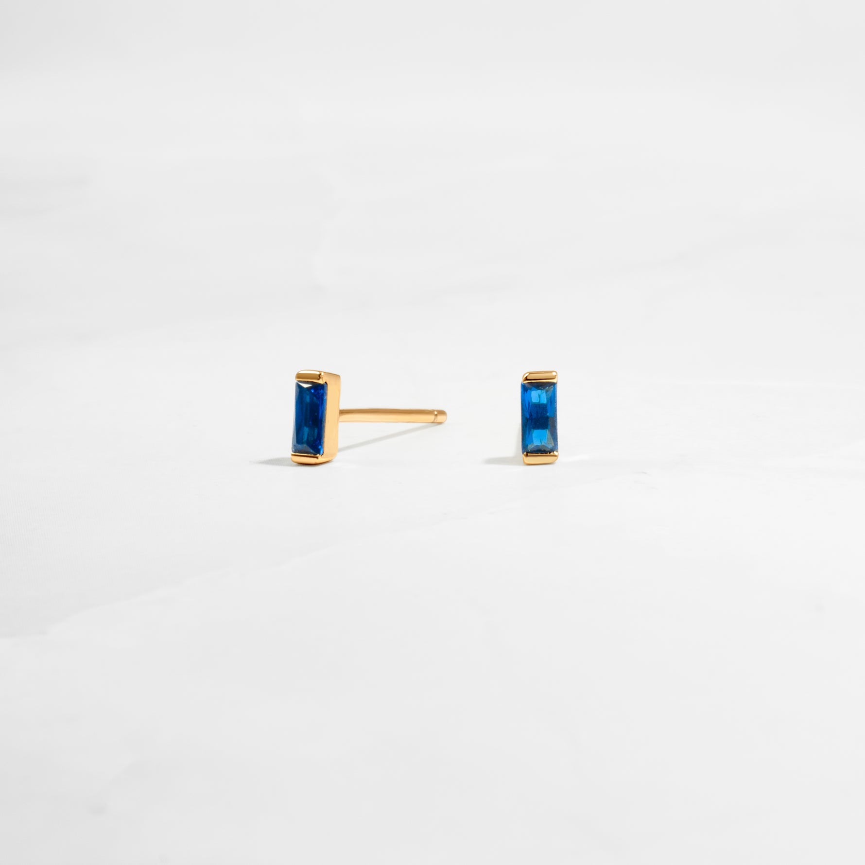 closeup image of dainty blue earrings