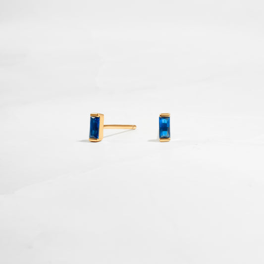 closeup image of dainty blue earrings