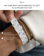 Bracelet sizer tool being used on a wrist 