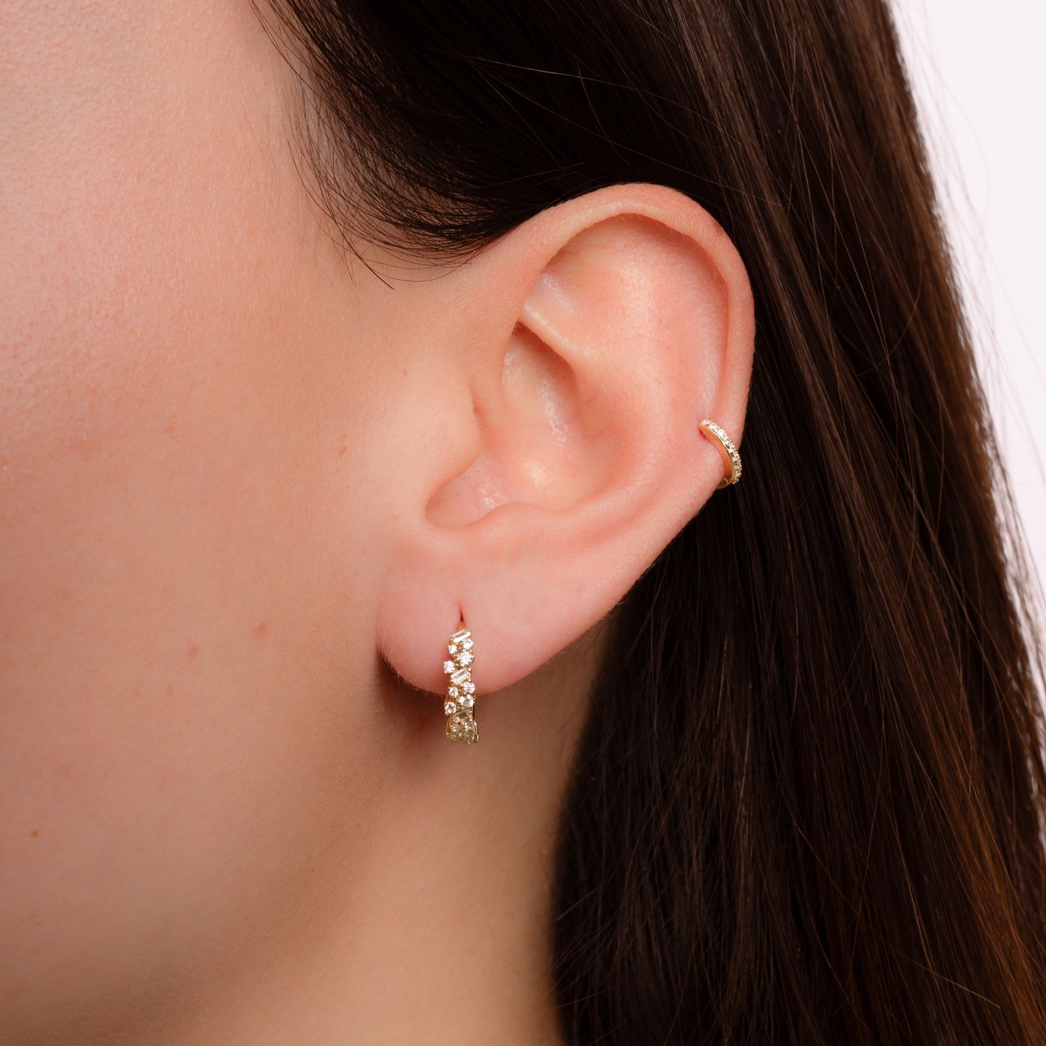 Model wearing gold cz hoop earrings