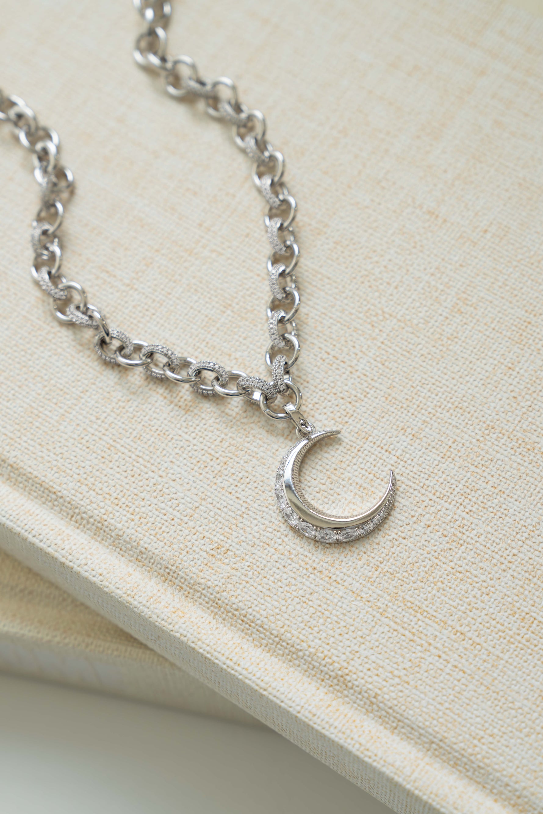 Sami Jewels Moon Statement Necklace featuring a celestial moon pendant on a delicate chain, perfect for elegant jewelry styling.