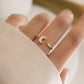 model wearing delicate opal moon ring