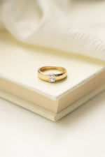 Gold Baguette Dome Ring by Sami Jewels featuring a chunky design and rectangular baguette gemstone setting.