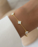model wearing four leaf clover stackable bracelet