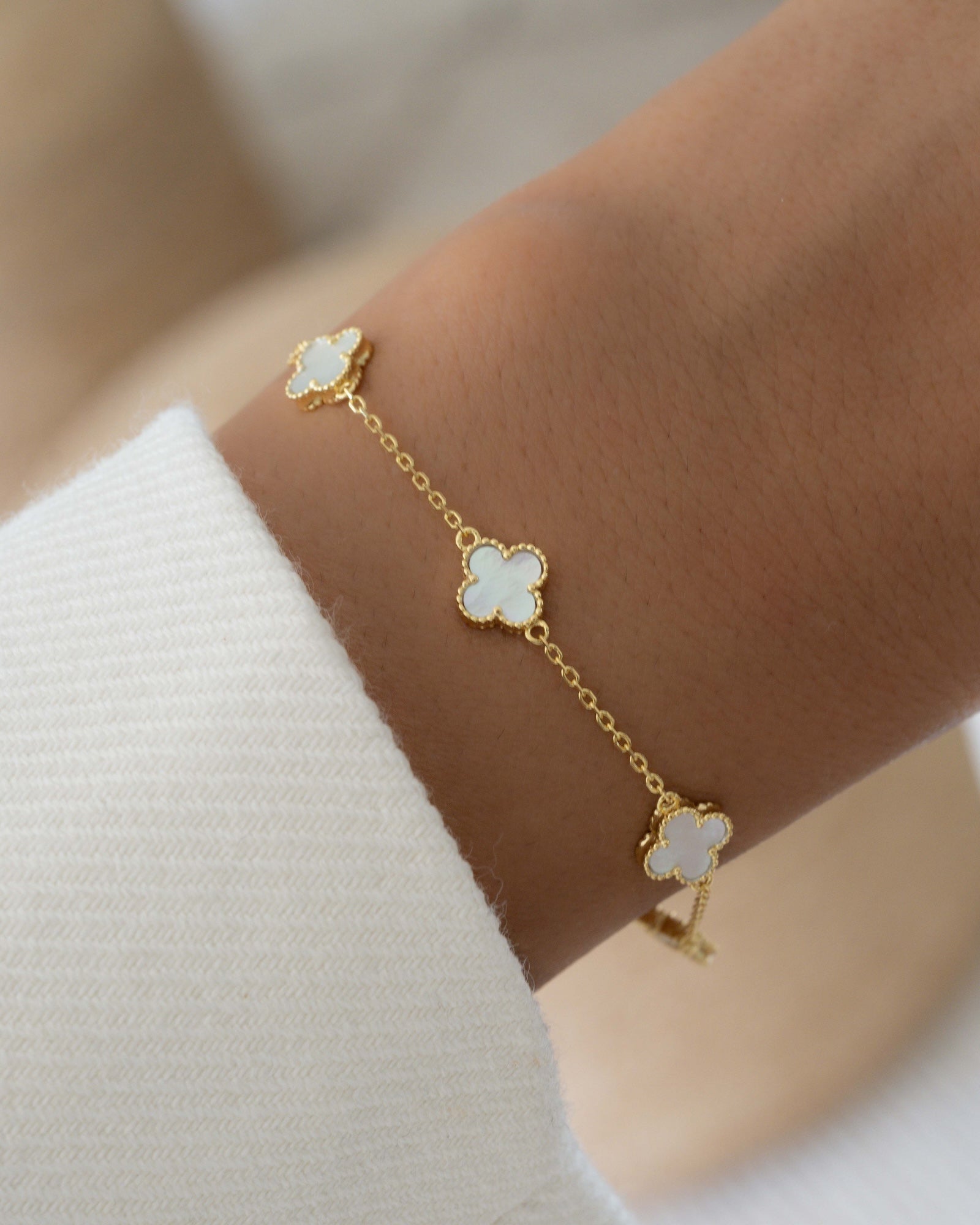 model wearing four leaf clover stackable bracelet