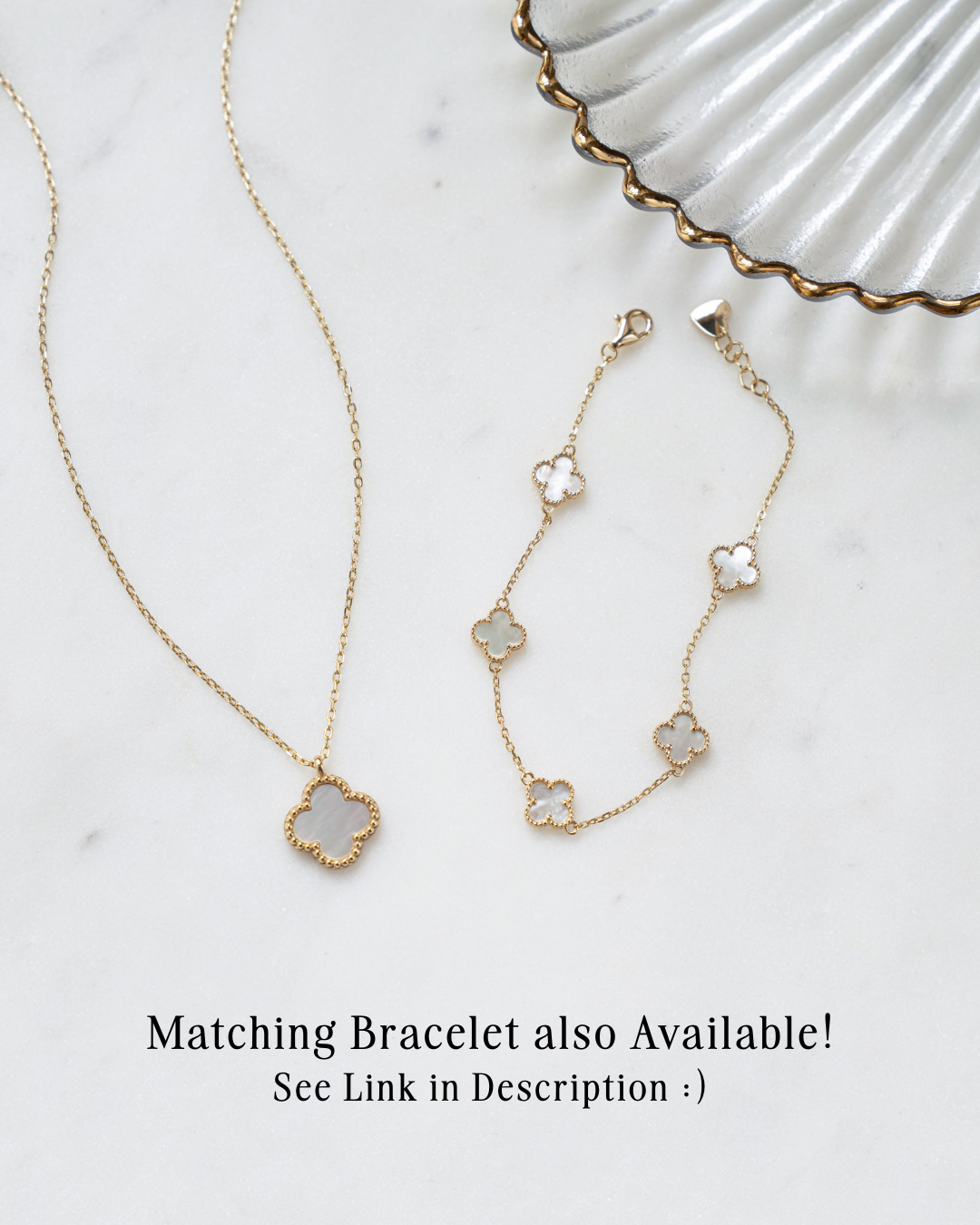 closeup image of gold clover necklace with matching gold four leaf clover bracelet
