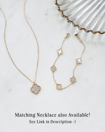 gold clover necklace paired with gold clover charm bracelet