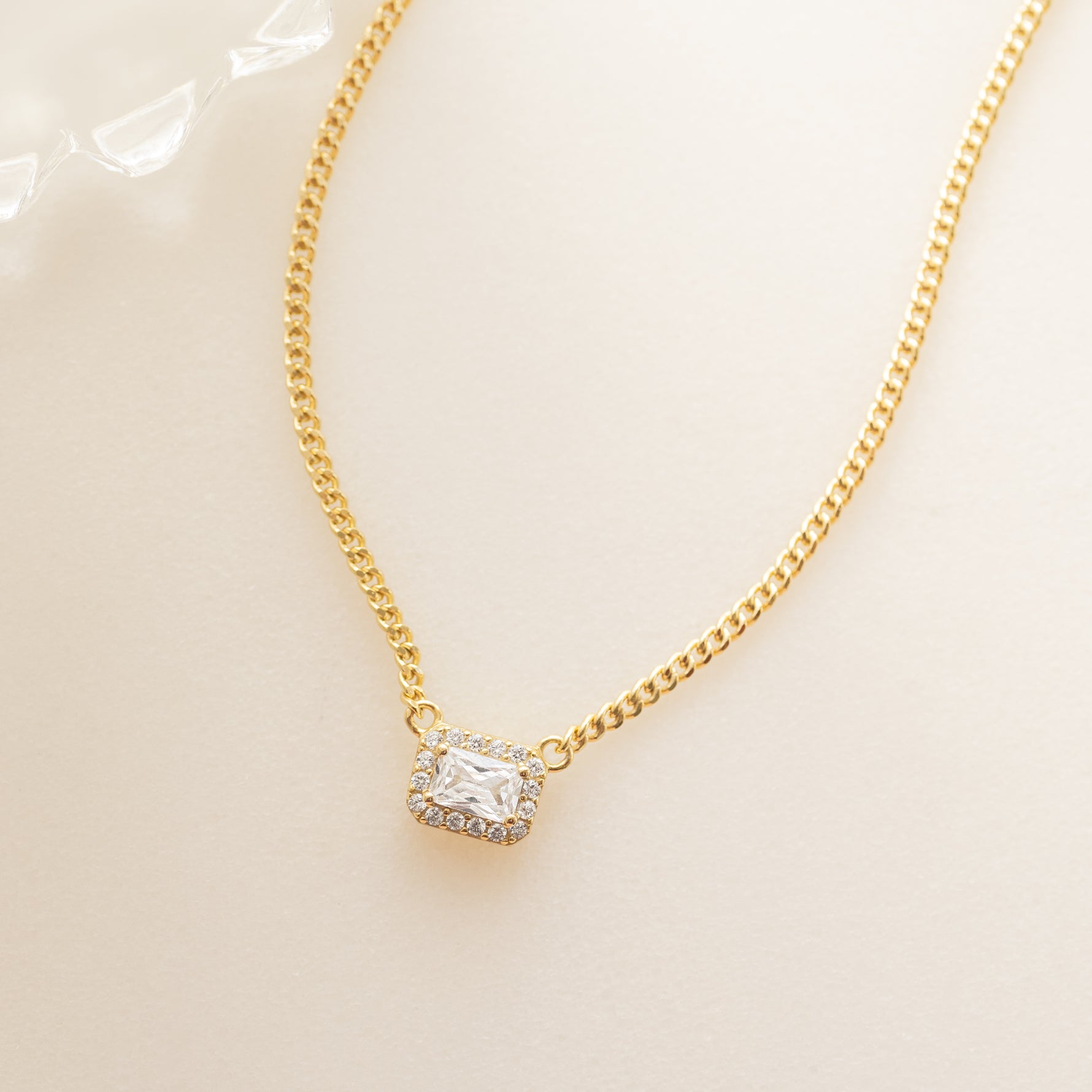 gold cubic zirconia halo emerald cut diamond necklace 