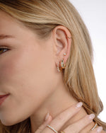 Gold tiny hoop earrings featuring diamond huggie hoops, thick hoop celestial earrings, and a small stud earring