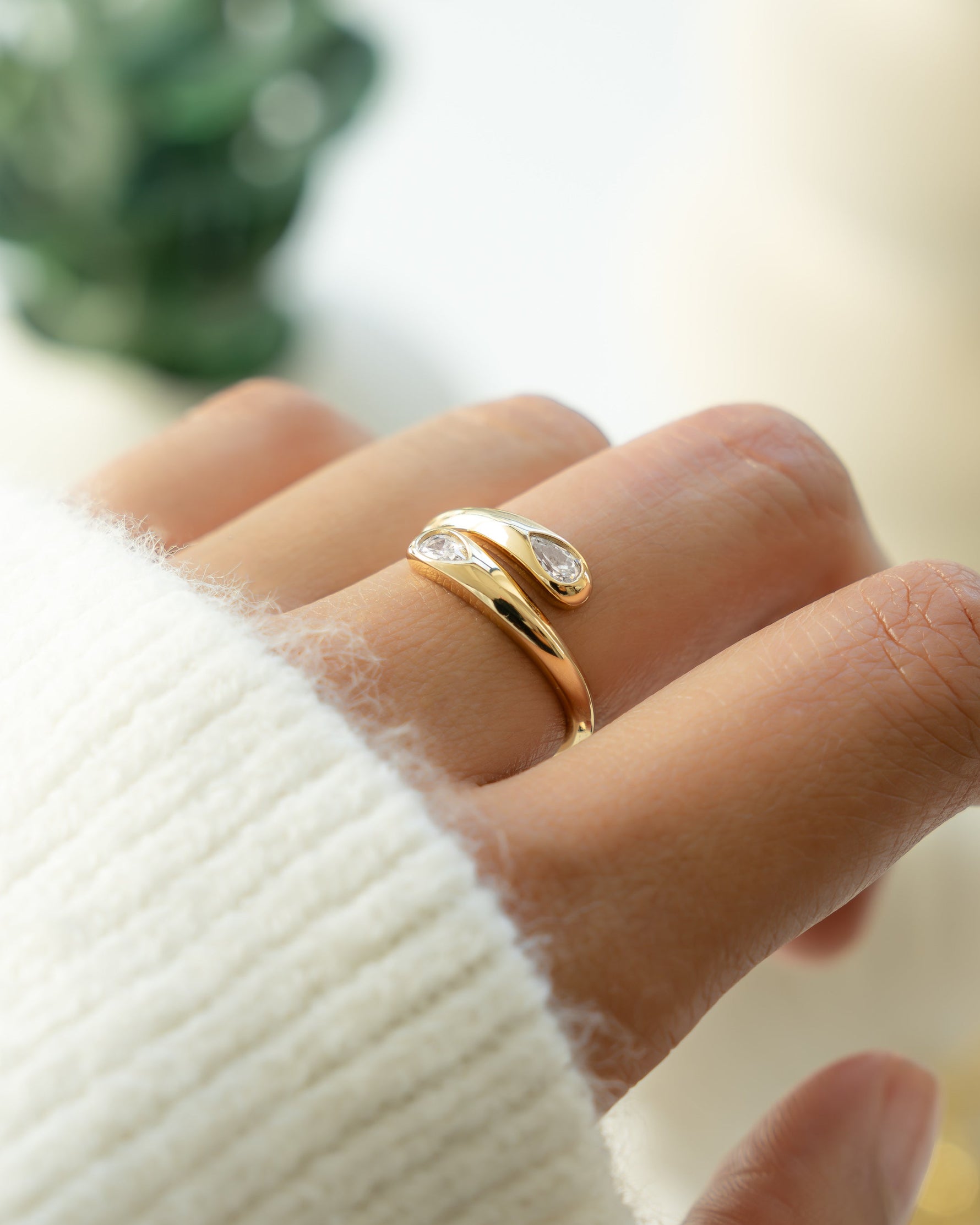 Gold stackable adjustable ring on models hand